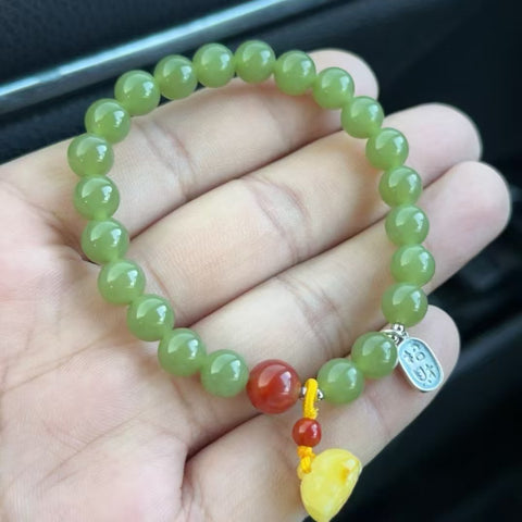 Gelang Giok Hetian Alami Warna hijau kekuningan Kualitas sempurna Ukuran 8mm Giok halus dan hangat Gaya yang indah sudah termasuk pajak pengiriman.