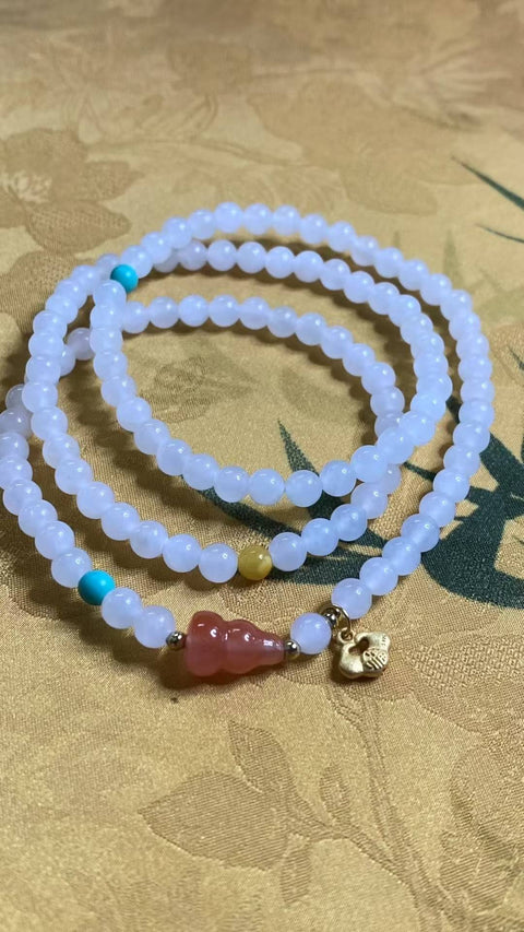 Gelang tiga lingkaran giok Hetian yang indah, serasi dengan aksesori Nanhong dan lilin madu. Spesifikasi: 5,1 mm, termasuk ongkos kirim dan pajak.