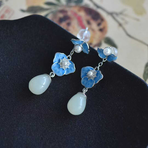Anting perak sterling 7994#925 dengan liontin bunga magnolia yang dapat dilepas, terbuat dari giok Hetian, desain dua untai. Dimensi giok: 7*10 mm. Harga sudah termasuk ongkos kirim dan pajak.