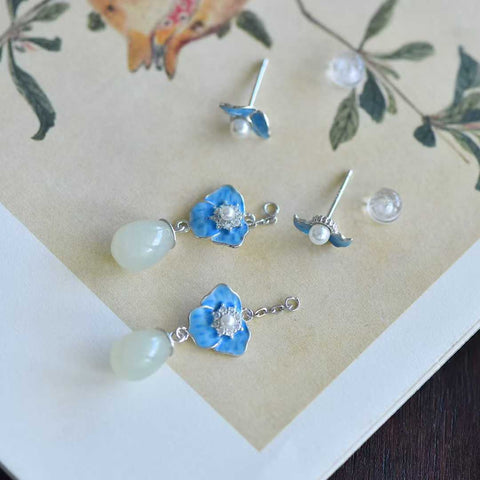 Anting perak sterling 7994#925 dengan liontin bunga magnolia yang dapat dilepas, terbuat dari giok Hetian, desain dua untai. Dimensi giok: 7*10 mm. Harga sudah termasuk ongkos kirim dan pajak.