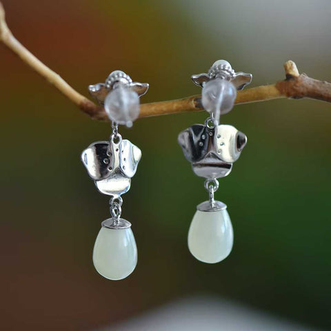 Anting perak sterling 7994#925 dengan liontin bunga magnolia yang dapat dilepas, terbuat dari giok Hetian, desain dua untai. Dimensi giok: 7*10 mm. Harga sudah termasuk ongkos kirim dan pajak.
