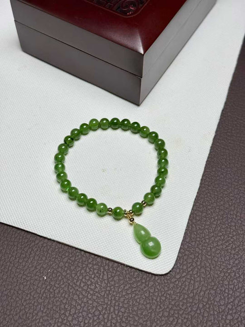 Gelang kiwi giok Hetian, warna hijau cerah, dipadukan dengan labu ukiran tangan. Ukuran perkiraan: 6mm. Termasuk ongkos kirim dan pajak.