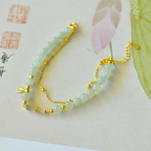 Gelang zirkon daun bambu berbentuk bambu (5*9) bertatahkan giok Hetian dari perak 925 6095-2#. Gioknya hangat dan lembut, dan desainnya baru dan unik. Ongkos kirim dan pajak sudah termasuk.