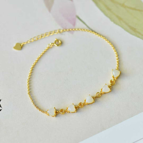 6096-2# Gelang Zirkon Berbentuk Hati (5*5) dengan Batu Giok Hetian Bertatahkan Perak 925. Batu gioknya hangat dan lembut, dan desainnya baru dan unik. Ongkos kirim dan pajak sudah termasuk.