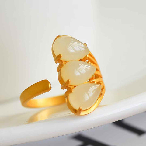 Cincin perak 1289-6#S925 bertatahkan giok Hetian (giok putih) berlapis emas buram. Gioknya bertekstur halus, berkilau, dan penuh warna. Desainnya elegan. Ongkos kirim dan pajak sudah termasuk.
