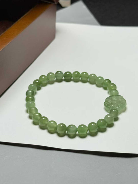 Gelang giok Hetian, hijau muda dan biru kemerahan, "Bunga Uang", dengan sedikit efek mata kucing. Ukuran perkiraan: 6mm. Termasuk ongkos kirim dan pajak.