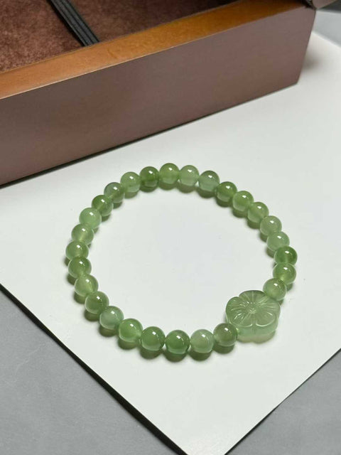 Gelang giok Hetian, hijau muda dan biru kemerahan, "Bunga Uang", dengan sedikit efek mata kucing. Ukuran perkiraan: 6mm. Termasuk ongkos kirim dan pajak.