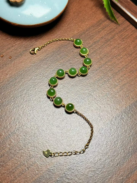 Gelang cabochon giok Hetian, terbuat dari giok nefrit hijau cerah pilihan, dipasang pada perak berwarna S925. Ukuran perkiraan: 6mm; Panjang total: 200mm. Termasuk ongkos kirim dan pajak.