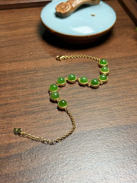 Gelang cabochon giok Hetian, terbuat dari giok nefrit hijau cerah pilihan, dipasang pada perak berwarna S925. Ukuran perkiraan: 6mm; Panjang total: 200mm. Termasuk ongkos kirim dan pajak.