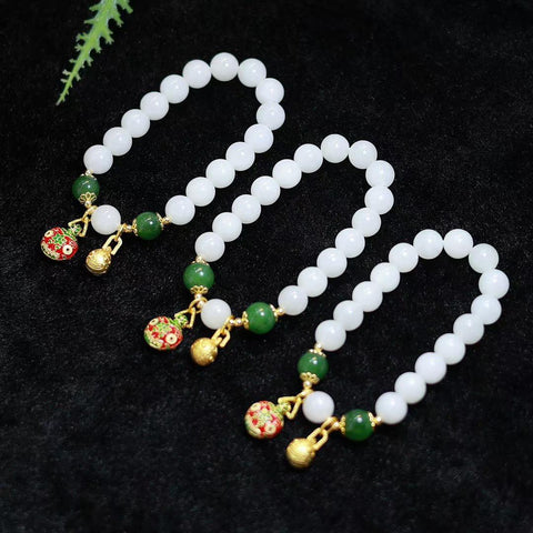 Gelang giok putih Hetian; manik-maniknya penuh dan bulat, giok putih kualitas terbaik – wajib dimiliki para dewi, sangat serbaguna; dilapisi emas 14k impor dengan manik-manik giok; ukuran batu permata 10mm; termasuk ongkos kirim dan pajak.