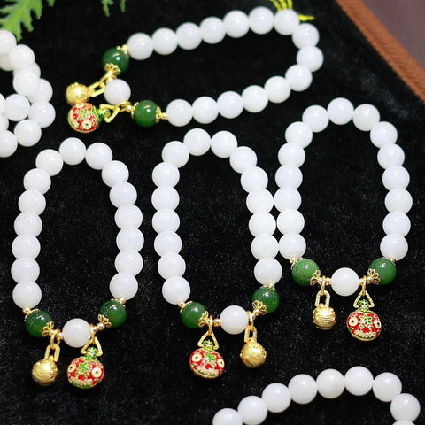 Gelang giok putih Hetian; manik-maniknya penuh dan bulat, giok putih kualitas terbaik – wajib dimiliki para dewi, sangat serbaguna; dilapisi emas 14k impor dengan manik-manik giok; ukuran batu permata 10mm; termasuk ongkos kirim dan pajak.