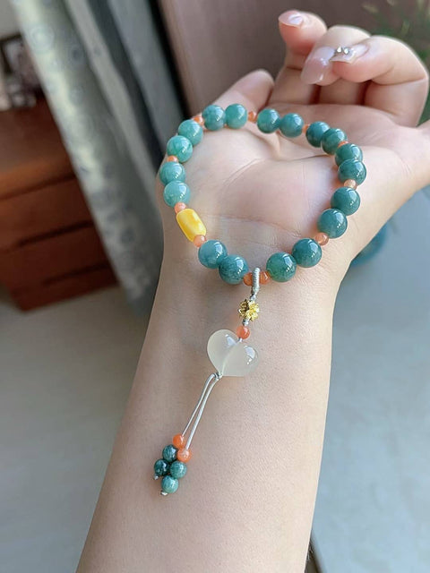 Gelang giok alami, material tambang lama, dipadukan dengan akik merah, amber, dan kalsedon. Diameter 8 mm. Harga sudah termasuk ongkos kirim dan pajak.