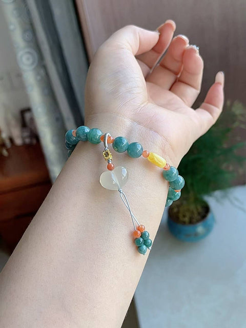 Gelang giok alami, material tambang lama, dipadukan dengan akik merah, amber, dan kalsedon. Diameter 8 mm. Harga sudah termasuk ongkos kirim dan pajak.