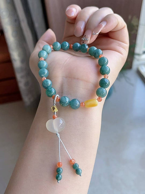 Gelang giok alami, material tambang lama, dipadukan dengan akik merah, amber, dan kalsedon. Diameter 8 mm. Harga sudah termasuk ongkos kirim dan pajak.