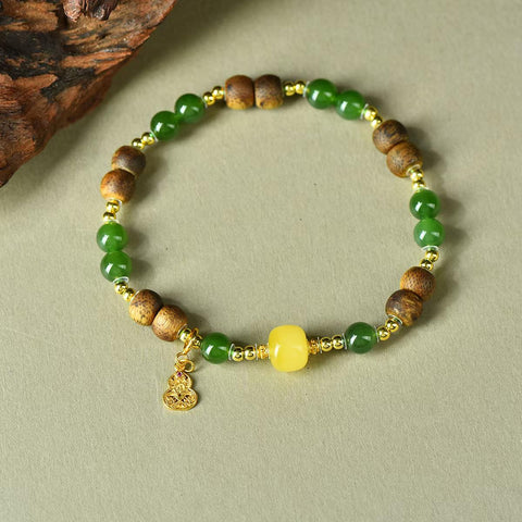 3388# Gelang labu lilin lebah perak S925 giok Hetian dan gaharu, 6mm. Gelang ini memadukan warna hangat lilin lebah, aroma gaharu, dan kilau giok. Pengiriman dan pajak sudah termasuk.