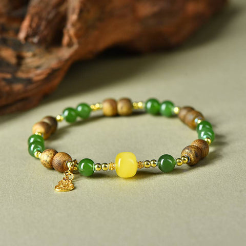 3388# Gelang labu lilin lebah perak S925 giok Hetian dan gaharu, 6mm. Gelang ini memadukan warna hangat lilin lebah, aroma gaharu, dan kilau giok. Pengiriman dan pajak sudah termasuk.