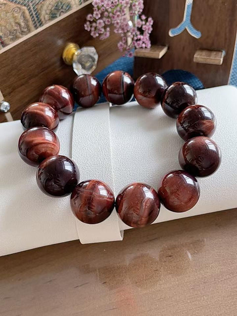 Gelang batu mata harimau alami, manik-manik besar, kilau luar biasa, dan kondisi sempurna. Sangat cocok untuk dipakai di musim panas, mempesona dan membawa keberuntungan. Hadiah sempurna untuk pria. Ukuran 1,8 cm. Termasuk ongkos kirim dan pajak.