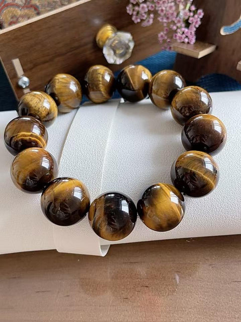 Gelang batu mata harimau alami, manik-manik besar, kilau luar biasa, dan kondisi sempurna. Sangat cocok untuk dipakai di musim panas, mempesona dan membawa keberuntungan. Hadiah sempurna untuk pria. Ukuran 1,8 cm. Termasuk ongkos kirim dan pajak.