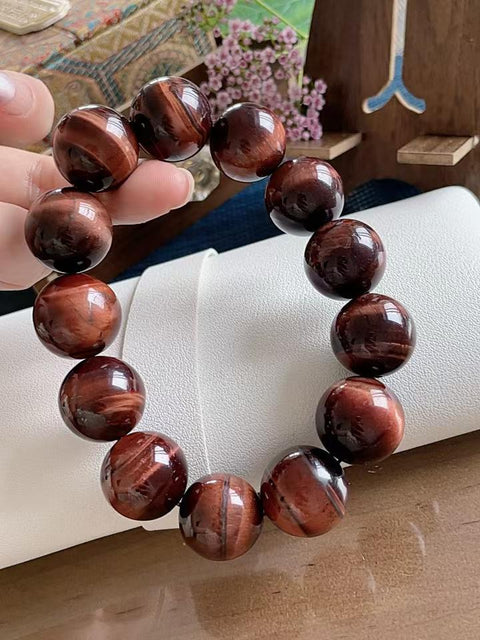 Gelang batu mata harimau alami, manik-manik besar, kilau luar biasa, dan kondisi sempurna. Sangat cocok untuk dipakai di musim panas, mempesona dan membawa keberuntungan. Hadiah sempurna untuk pria. Ukuran 1,8 cm. Termasuk ongkos kirim dan pajak.