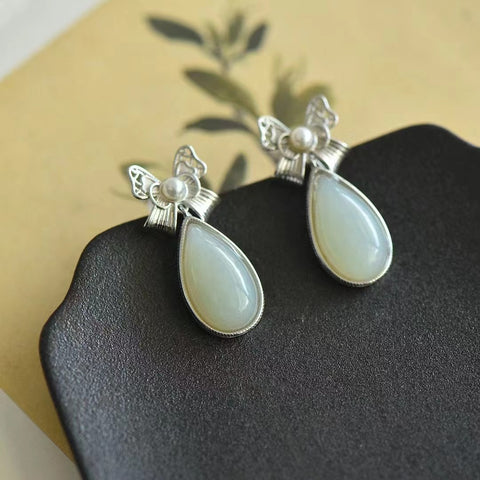 7754 Anting Busur Giok Giok Hetian Alami yang terbuat dari 925 perak; Ukuran 10 * 18mm; Gaya yang unik; Jumlah sudah termasuk pajak pengiriman.