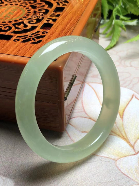 Gelang Air Madu Giok Cui Giok bersih, halus dan hangat Ukuran 52 * 11mm Giok terjadi secara alami Pola acak Termasuk pajak pengiriman.